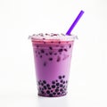bubble tea glass with blueberry milk drink, ice cubes and bubbles.