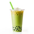 bubble tea glass with milky green drink with matcha, ice cubes and bubbles.