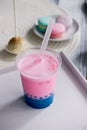 Bubble tea in pink and blue color in a plastic Cup with a straw. Soft,beautiful colors Royalty Free Stock Photo