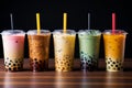 Bubble tea in various settings on dark background, variety of tapioca tea milkshake in a row.