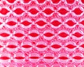 Bubble wrap in front of pink paper.