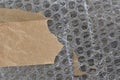 bubble wrap plastic and adhesive tape background texture with copyspace Royalty Free Stock Photo