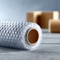 Bubble wrap roll on a textured surface Royalty Free Stock Photo