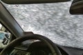 Bubbles are caused by car wash. Man washing his car in a self-service car wash station. Shooting from inside the car Royalty Free Stock Photo