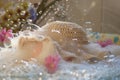 bubbles clinging to a baby hat as it soaks in sudsy water