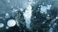 Bubbles of different sizes inside the ice, lake Baikal, Siberia, Russia