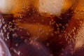 Bubbles and fizz. A cool glass of cola drink with ice Royalty Free Stock Photo