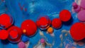 Bubbles float in liquid paint, mixing ink, oil and milk, abstract multicolor hypnotic painting Royalty Free Stock Photo