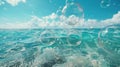 Bubbles Floating in Clear Ocean Water Under Bright Blue Sky Royalty Free Stock Photo