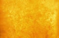 Bubbles floating in the liquid orange drink, abstract image. Royalty Free Stock Photo