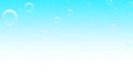 Bubbles floating upwards in light blue gradient background for design element Royalty Free Stock Photo