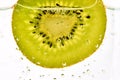 Bubbles In Front Of Fresh Kiwi Royalty Free Stock Photo