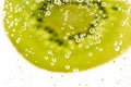 Bubbles In Front Of Fresh Kiwi Royalty Free Stock Photo