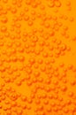 Bubbles in orange soda Royalty Free Stock Photo
