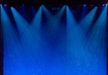 Bubbles and rays of blue light through the smoke on stage Royalty Free Stock Photo