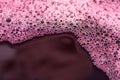Bubbles of red wine closeup. Alcoholic background Royalty Free Stock Photo
