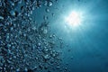 Bubbles and sunlight underwater. Blue abstract background