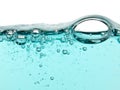 Bubbles in turquoise liquid soap