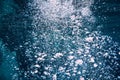 Bubbles underwater in blue ocean transparent water Royalty Free Stock Photo