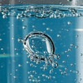 Bubbles of various sizes rise through a clear liquid, possibly water or a carbonated Royalty Free Stock Photo