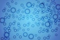 Bubbles in water on blue background horizontal pattern. Circle and liquid, light design, clear soapy shiny Royalty Free Stock Photo