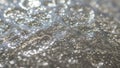 Bubbles and water droplets create a shimmering textured surface Royalty Free Stock Photo
