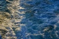 Bubbling blue waves of traces of tourist cruise ships passing on the Bosporus. Water trail foaming behind a passenger