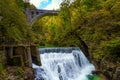 Bubbling foamy waterfalls under bridge