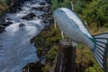 The bubbling Ketchikan Creek runs passed a sculpture of a salmon