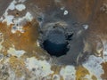 Bubbling mud pot in a geothermal area, directly above view Royalty Free Stock Photo