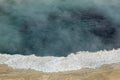 Bubbling, steaming, boiling aqua water in Yellowstone Park, Wyoming. Royalty Free Stock Photo