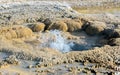 Bubbling water in geyser pool in Yellowstone National Park Royalty Free Stock Photo