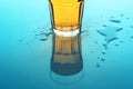 Bubbling yellow fizzy soda drink in glass, close up Royalty Free Stock Photo