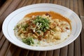 Bubur ayam or chicken porridge, Indonesian rice porridge with shredded chicken and chunks of cakwe. Breakfast dish of rice