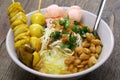 Bubur ayam, an Indonesian chicken congee. breakfast staple. Royalty Free Stock Photo