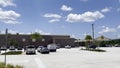 Buc-ee\'s retail store parking lot blue sky puffy clouds Royalty Free Stock Photo