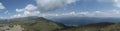 The panoramic view from the top of the Bucegi mountains and, in the distance, the Prahova Valley Royalty Free Stock Photo