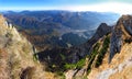 Bucegi mountains high altitude panorama, steep heels in autumn - Busteni city view Royalty Free Stock Photo