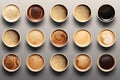 Buch of coffee cups with different kind of beverage and different latte art foam designs. Top view, close up, copy space