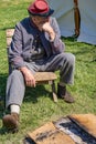 Male Confederate Reenactor Next to the Campfire