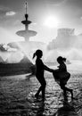 Bucharest central fountain on a hot summer day with children having fun