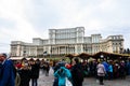 Bucharest Christmas market in front of the Palace of Parliament, Christmas tree, lights, people wandering at the Christmas market