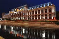 Bucharest courthouse at sundown looking over Dambovita river Royalty Free Stock Photo