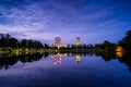 Bucharest office buildings at blue hour with lake reflection in summer time , Romania Royalty Free Stock Photo