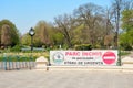 Cismigiu Park entrance closed with a stop sign reading `Closed Park during state of emergency`, part of lockdown measures.