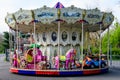 Bucharest, Romania - 24 April 2021: Colourful children colorful carousel with mixed plastic and metallic toys and materials in