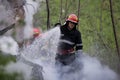 Firefighters using water hoses to extinguish a fire