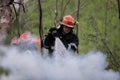 Firefighters using water hoses to extinguish a fire