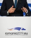 Logo of the Romanian Presidency of the Council of the European Union during a press briefing