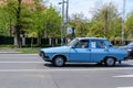 Bucharest, Romania, 24 April 2021 Old retro vivid blue Romanian Dacia 1310 classic car in traffic in a street in a sunny spring